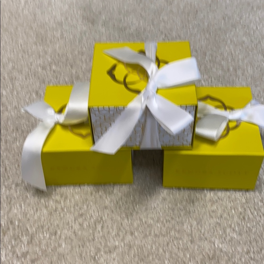Three Kendra Scott boxes